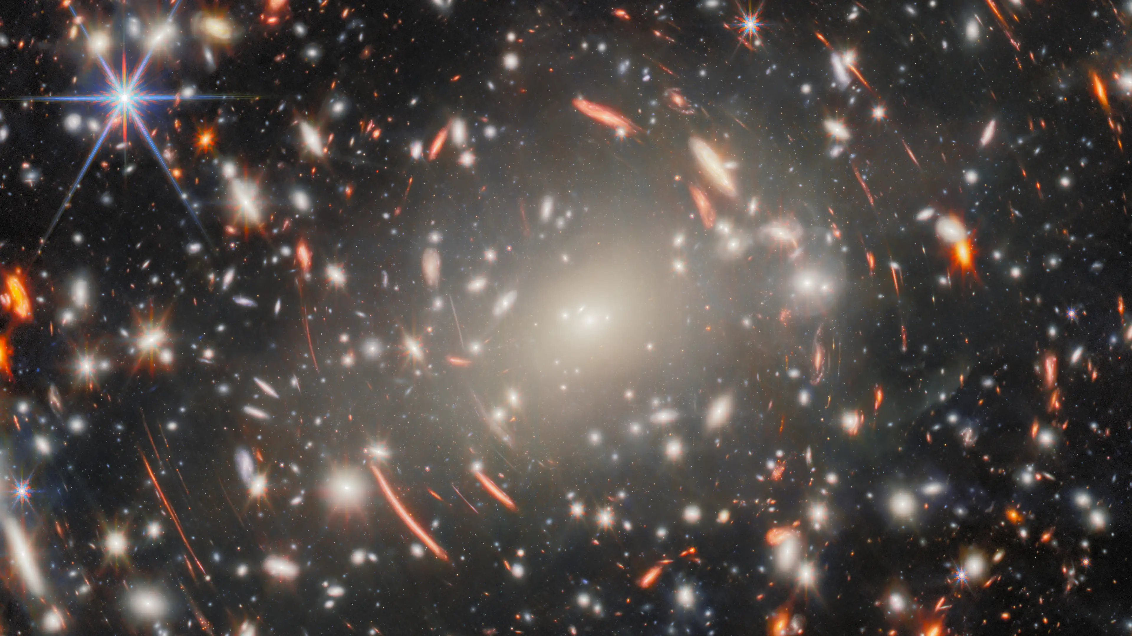 A galaxy cluster and distant galaxies